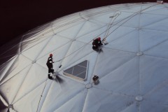2 workers outside an aluminium dome roof